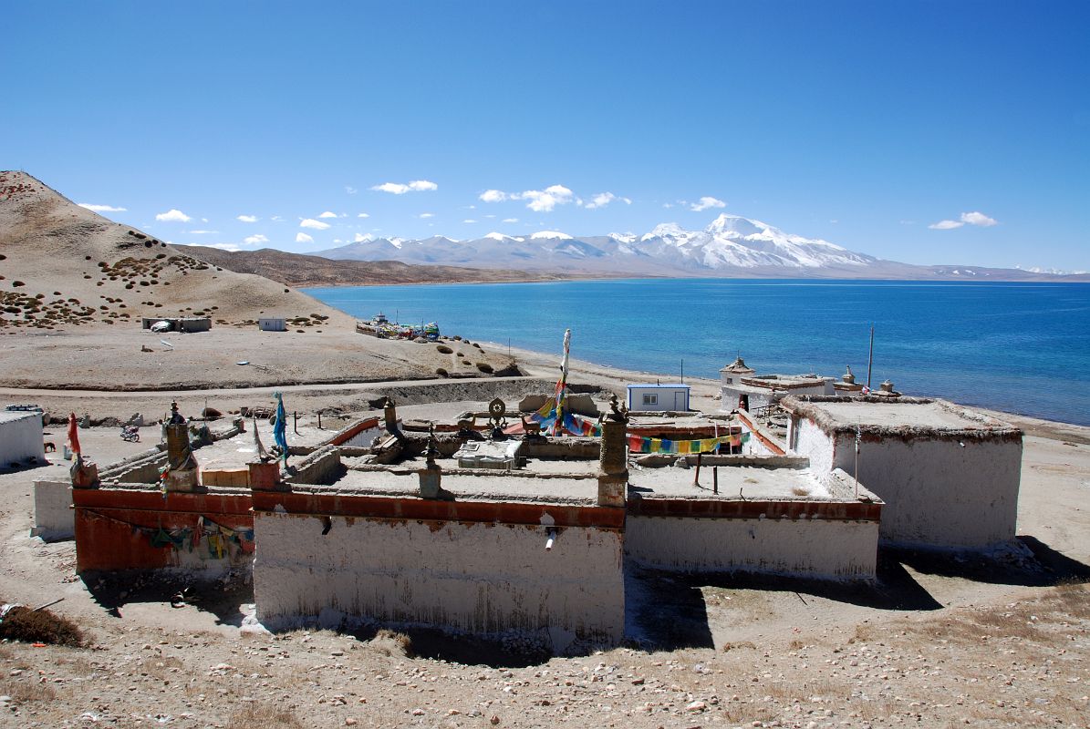 08 Seralung Gompa With Lake Manasarovar And Gurla Mandhata From Hor Qu we drive the Lake Manasarovar Kora, following dirt roads around the lake and stopping at monasteries en route. Our first stop on the Kora was Seralung Gompa at the northeast corner of the lake.